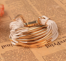Armband i flera lager med rep och Guldfärgad metall -finns i Beige och Svart