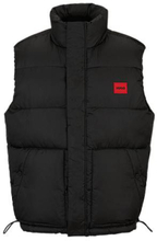 Water-repellent puffer gilet with red logo badge