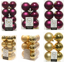 Kerstversiering kunststof kerstballen mix framboos roze/goud 4-6-8 cm pakket van 68x stuks
