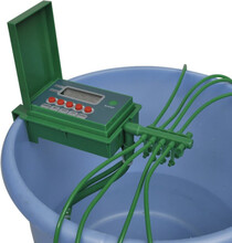 Automatiskt bevattningssystem med vattenspridare och timer