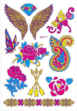 Ark med Forskjellige Fluorescerende Vinger, Diamant, Blomster og Andre Tatoveringer (UV Fake Tattoo)