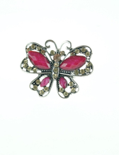 zilverkleurige vlinder ring met roze stenen