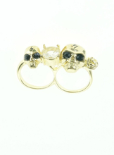 Goldtone dubbele ring met 2 skulls