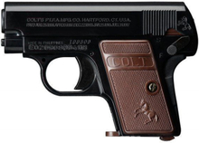 Colt 25 svart, fjäderdriven pistol