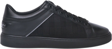Low-top trainers in black leather and fabric